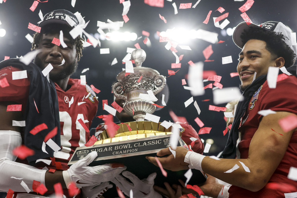 Young (with Will Anderson Jr., far left), ended his college career by throwing five TDs in the Sugar Bowl. 